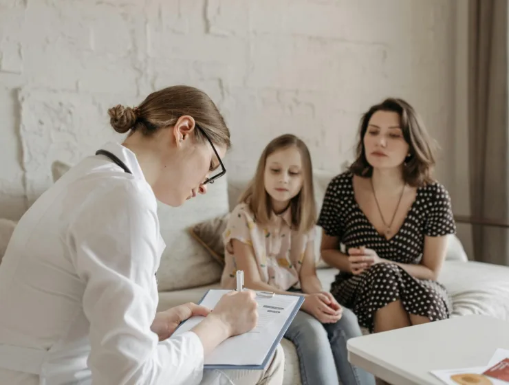 mom talking to pediatrician about child’s health