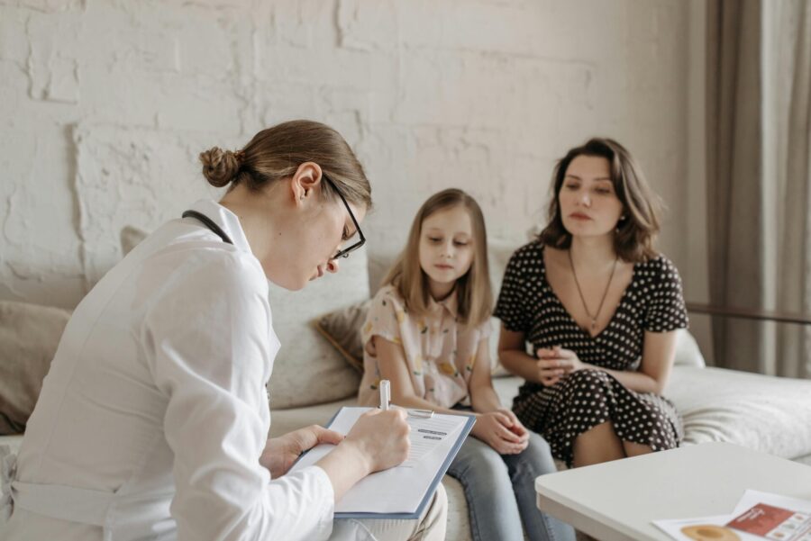 mom talking to pediatrician about child’s health